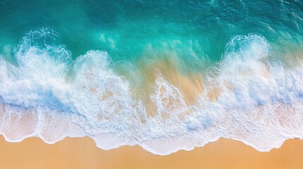 Fototapeta premium Aerial view of ocean waves splashing along the shore