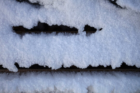 Wooden boards covered with snow. Background.     
