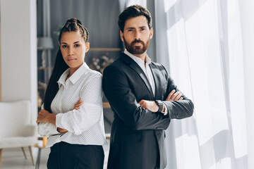 Portrait of serious, pensive businesspeople wearing stylish formal wear, fashion model posing