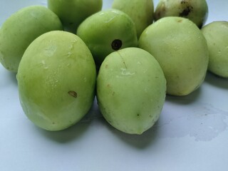 Organic raw tomatoes. Green unripe tomatoes.
