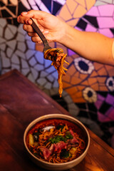 Delicious noodles with beef, close-up shot.