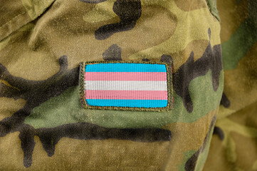 Cropped closeup shot of a transgender flag on a soldier's uniform