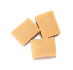 Tasty sweet caramel candies isolated on white, top view
