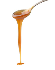 Tasty caramel sauce dripping from spoon on white background, closeup