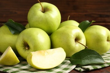 Fresh green apples on wooden table, closeup