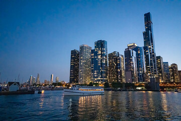 Fototapeta premium Chicago, IL - July 25, 2024: Amazing night view of Downtown Chicago skyscrapers from a cruise along the city river