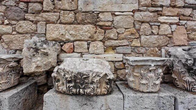 Panning shot of Rocks on the remains of the Roman Forum of Athens (Roman Agora) in Athens, Greece. Video reveals history.