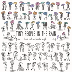 Set of tiny hand drawn people walking with their umbrellas in the rain © Franzi draws