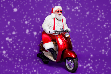 Photo of grey hair santa claus traveler man rushing newyear theme party by bike cool modern style...