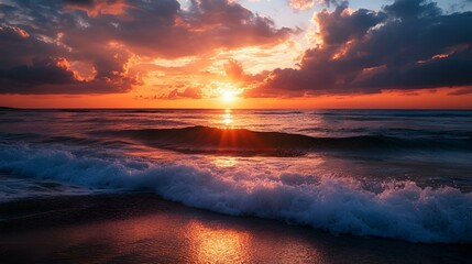 Vibrant sunset over the ocean with dramatic clouds.