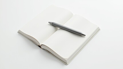 A modern matte metallic pen resting on an open minimalist notebook with crisp white pages.