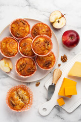 Apple cheese cupcakes or  muffins with walnut on a plate. Top view
