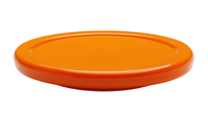Bright orange disc resting on a plain surface evokes playful outdoor activities on a sunny day