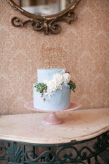 Two-tier blue frosting wedding or birthday cake, Happily Ever After cake topper, Vintage Retro Wedding Day Cake, Flowers on a cake, Bridal cake, Vintage pink glass cake dish