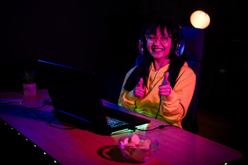 Photo of gamer lovely young lady point you hello play strategy game gamer laptop late night room indoors