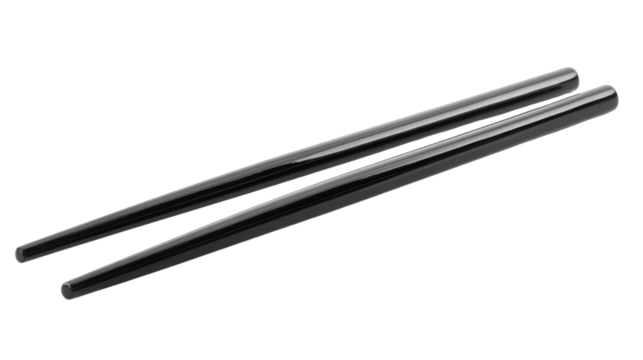 Elegant black chopsticks resting on a simple white surface ready for an Asian culinary experience - Powered by Adobe