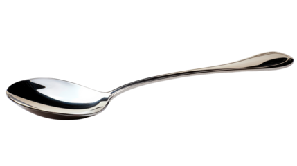 A shiny stainless steel spoon reflecting light in a minimalistic kitchen setting