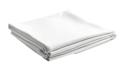 Freshly folded white linen cloth resting elegantly on a smooth table surface in natural light