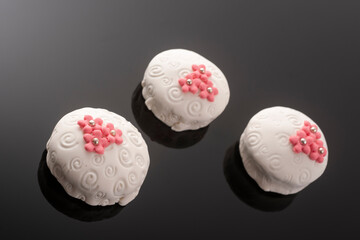 Tasty colorful cupcakes on blackbackground