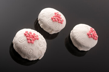 Tasty colorful cupcakes on blackbackground