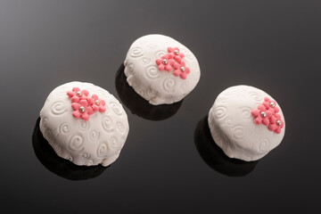 Tasty colorful cupcakes on blackbackground