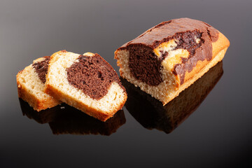 Homemade freshly baked chocolate pound cake loaf. Delicious homemade dessert. Slices on a cutting board. Selective focus