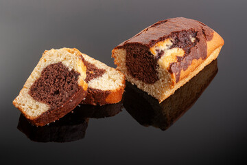 Homemade freshly baked chocolate pound cake loaf. Delicious homemade dessert. Slices on a cutting board. Selective focus