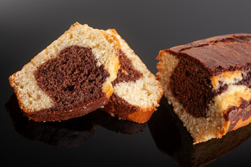Homemade freshly baked chocolate pound cake loaf. Delicious homemade dessert. Slices on a cutting board. Selective focus