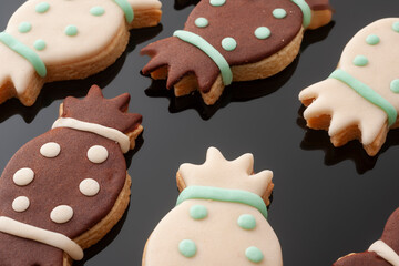 Sweet cookies on a black background.