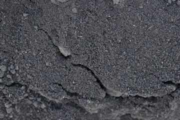 Close up black earth texture, black earth texture, macro texture of earth as background 