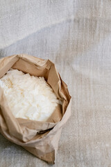 Organic soy wax flakes in eco-conscious kraft bag