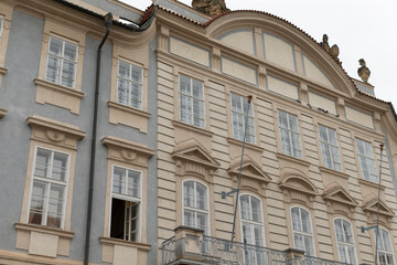 There is a large and impressive building that features a stylish balcony protruding from the side of it, adding to its charm and appeal