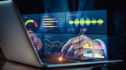 Businessman analyzing advanced analytics on a laptop screen, showcasing colorful data visualization graphs