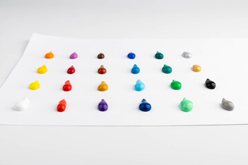 Paint blobs of different colors isolated on white, set