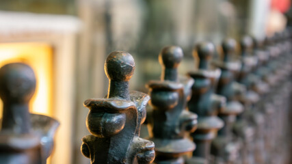Decorative metal fence post details highlighting craftsmanship in an urban setting