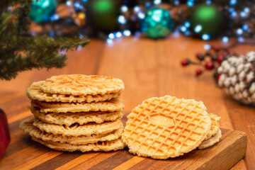 Pizzelle cookies stacked in a Christmas setting