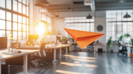 A paper airplane flying across an office setting, symbolizing change, leadership, and innovative thinking for business success
