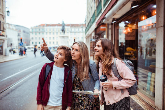 Mother and kids exploring the city of Lisbon during family vacation