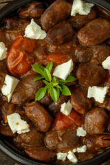 Close-up view of  Ful Mudammas (Medammes). Egyptian dish made of dried fava bean, onion, garlic, tomatoes, and olive oil, often served as a sandwich filler. 