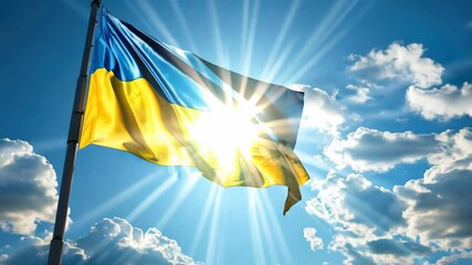 Flag with a yellow stripe and blue stripe is flying in the sky. The sun is shining brightly on the flag, making it look vibrant and lively
