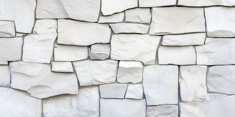 Textured white stone wall with irregular shapes and sizes, creating modern and natural aesthetic. This design adds unique touch to any space, enhancing its visual appeal