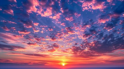 Fototapeta premium Dramatic Sunset Sky with Vibrant Cloud Formations and Glowing Sunlight over Serene Landscape Backdrop