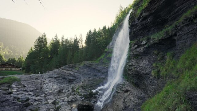 Cascade du Rouget waterfall flowing in the forest during the morning at Sixt fer a cheval, France