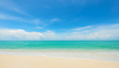 Fototapeta premium Tranquil beach with white sand meets a turquoise ocean, under a bright blue sky with puffy clouds.