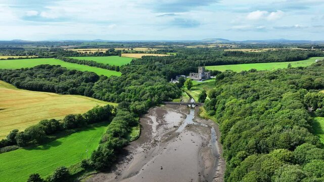 Ireland Epic locations drone landscape slowly flying to Tintern Abbey colours of summer in Wexford Ireland