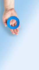 Blue circle in women's hands on blue background universal symbol of diabetes mellitus. World...