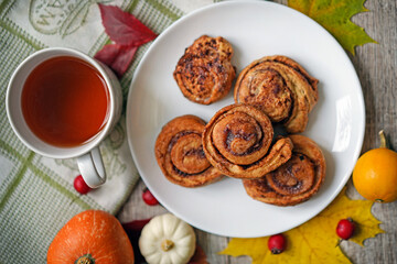 Autumn breakfast. Buns and tea. Sweet Deserts, home made, on wood background