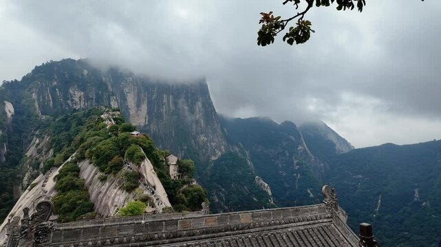 Huashan, China: Panoramic footage of a temple roof in the north peak in famous Mount Huashan mountain near Xi'An in Shaanxi in central China. 