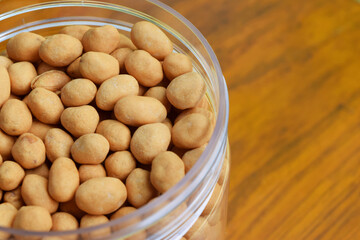 Closeup photo of Dried atomic beans in food storage or jar on wooden table