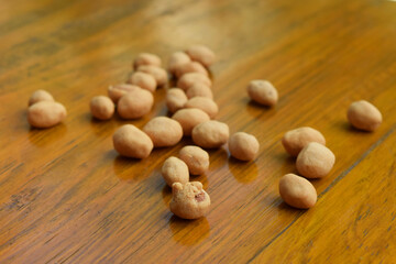 Top view of some dried atomic Nuts and food storage or jars on wooden table